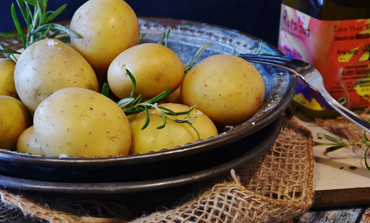 Potatoes are kept in a bowl on a table